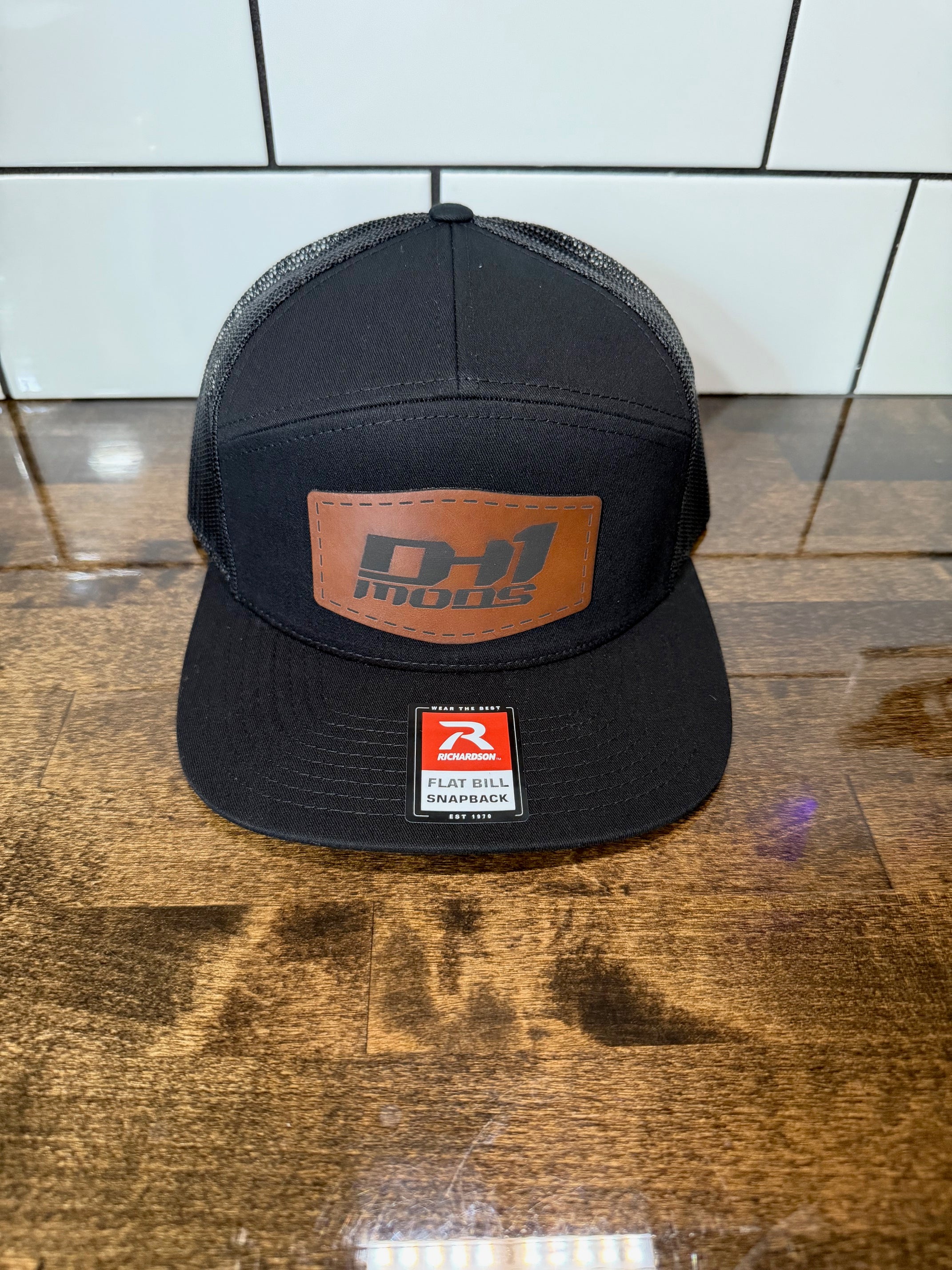 DH1 - SOLID BLACK Richardson 168 flat bill hat with brown leather patch